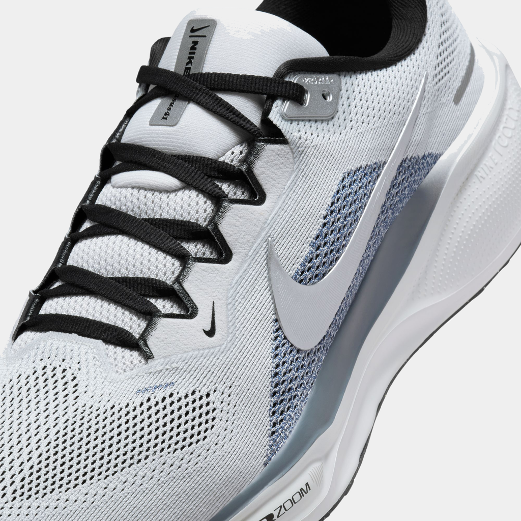 A pair of white and black Nike Air Zoom Pegasus 41 running shoes with a white and black sole.