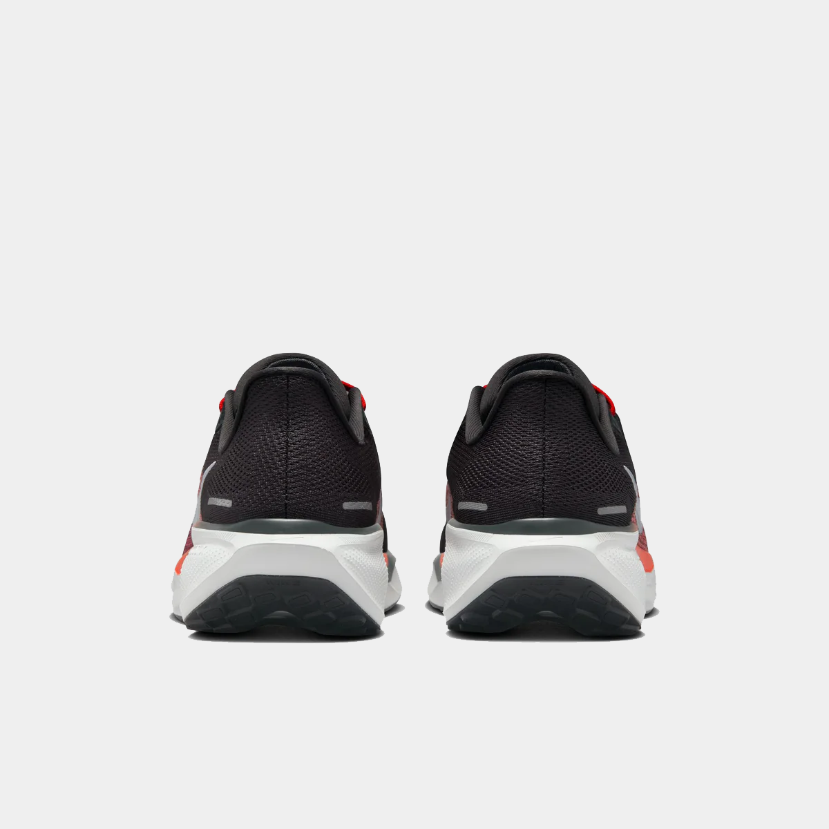 A pair of black Nike Air Zoom Pegasus 41 running shoes with white and red accents and a black and white sole.