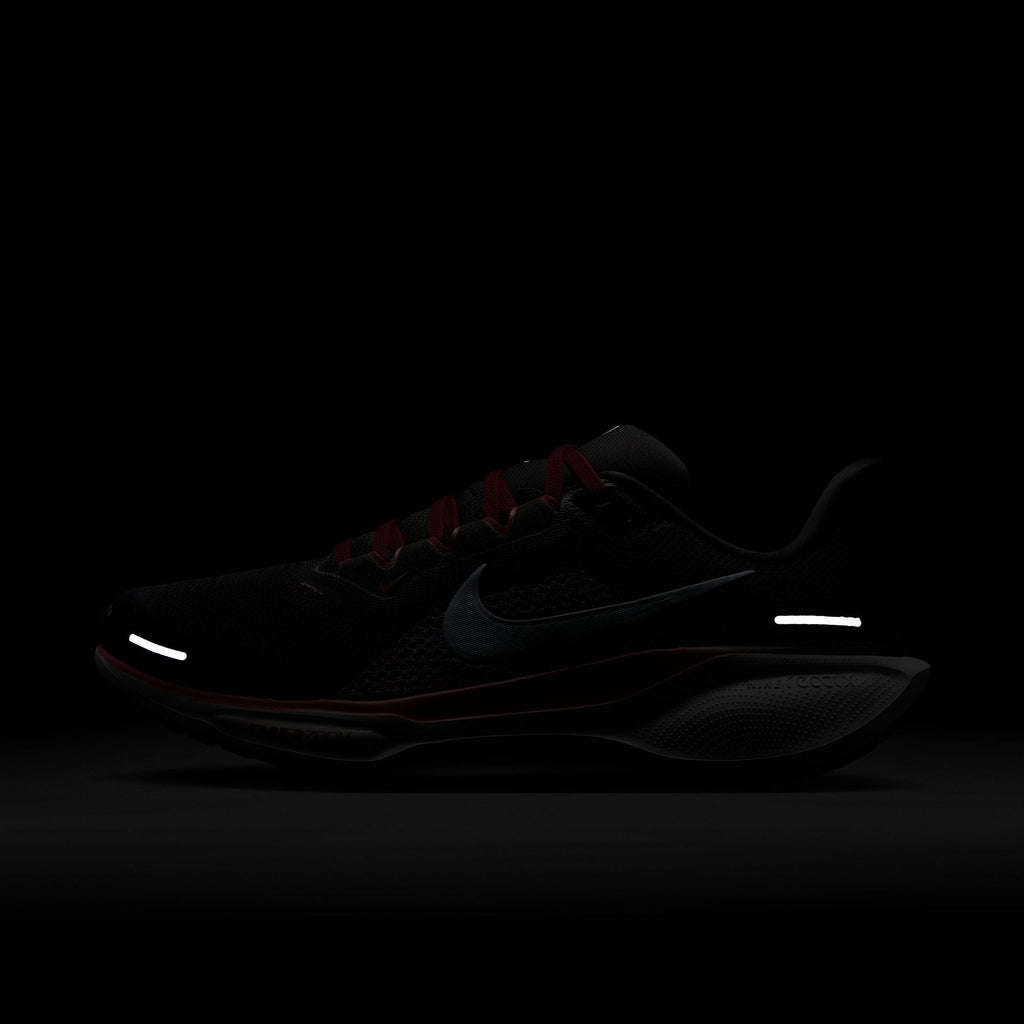 A pair of black Nike Air Zoom Pegasus 41 running shoes with white and red accents and a black and white sole.