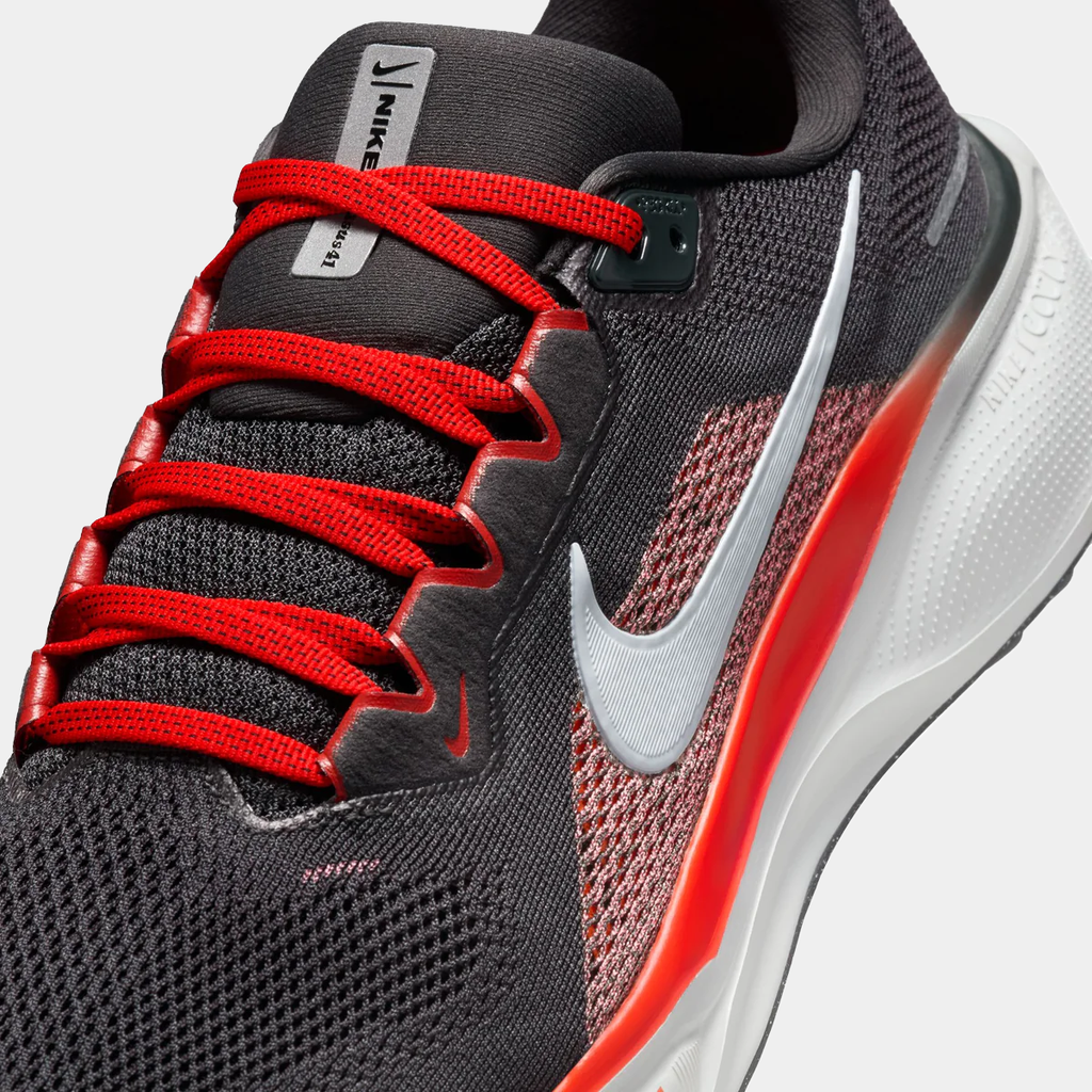 A pair of black Nike Air Zoom Pegasus 41 running shoes with white and red accents and a black and white sole.