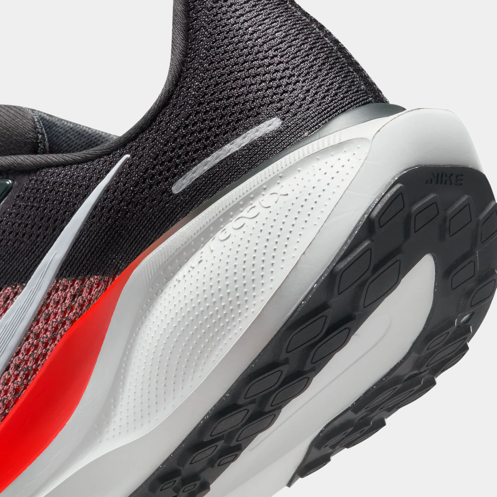 A pair of black Nike Air Zoom Pegasus 41 running shoes with white and red accents and a black and white sole.