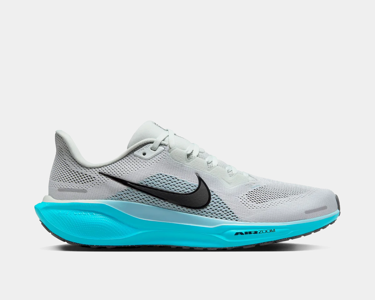 A pair of white Nike Air Zoom Pegasus 41 running shoes with black and blue accents and a black and white sole.
