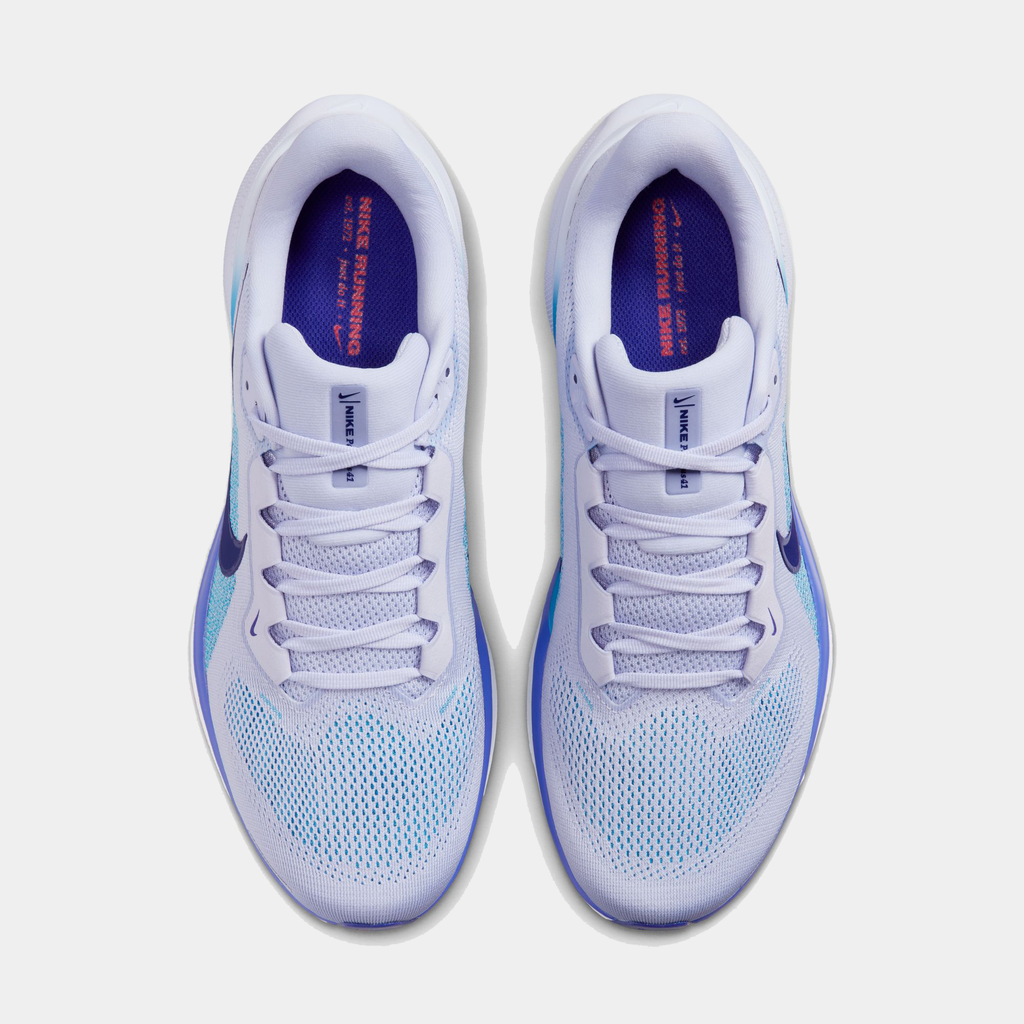 A pair of white Nike Air Zoom Pegasus 41 running shoes with black and blue accents and a black and white sole.