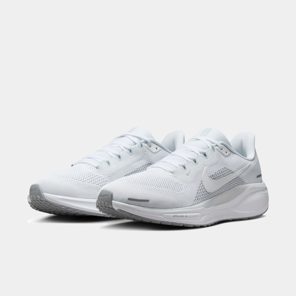 A pair of white Nike Air Zoom Pegasus 41 running shoes with white accents .