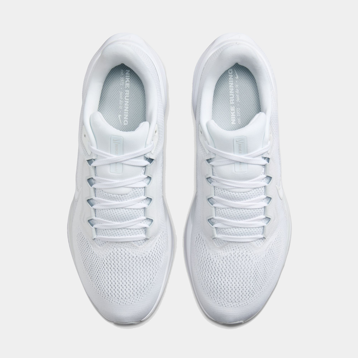 A pair of white Nike Air Zoom Pegasus 41 running shoes with white accents .