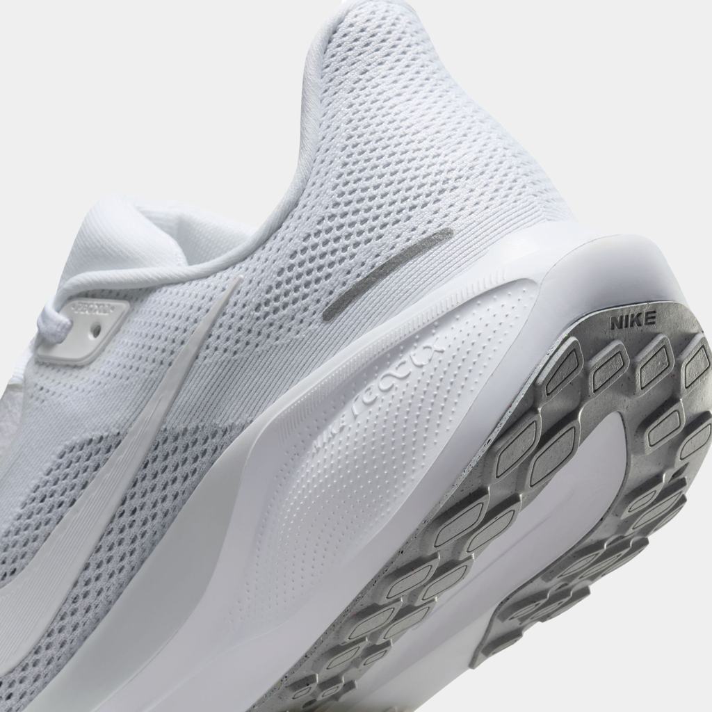 A pair of white Nike Air Zoom Pegasus 41 running shoes with white accents .