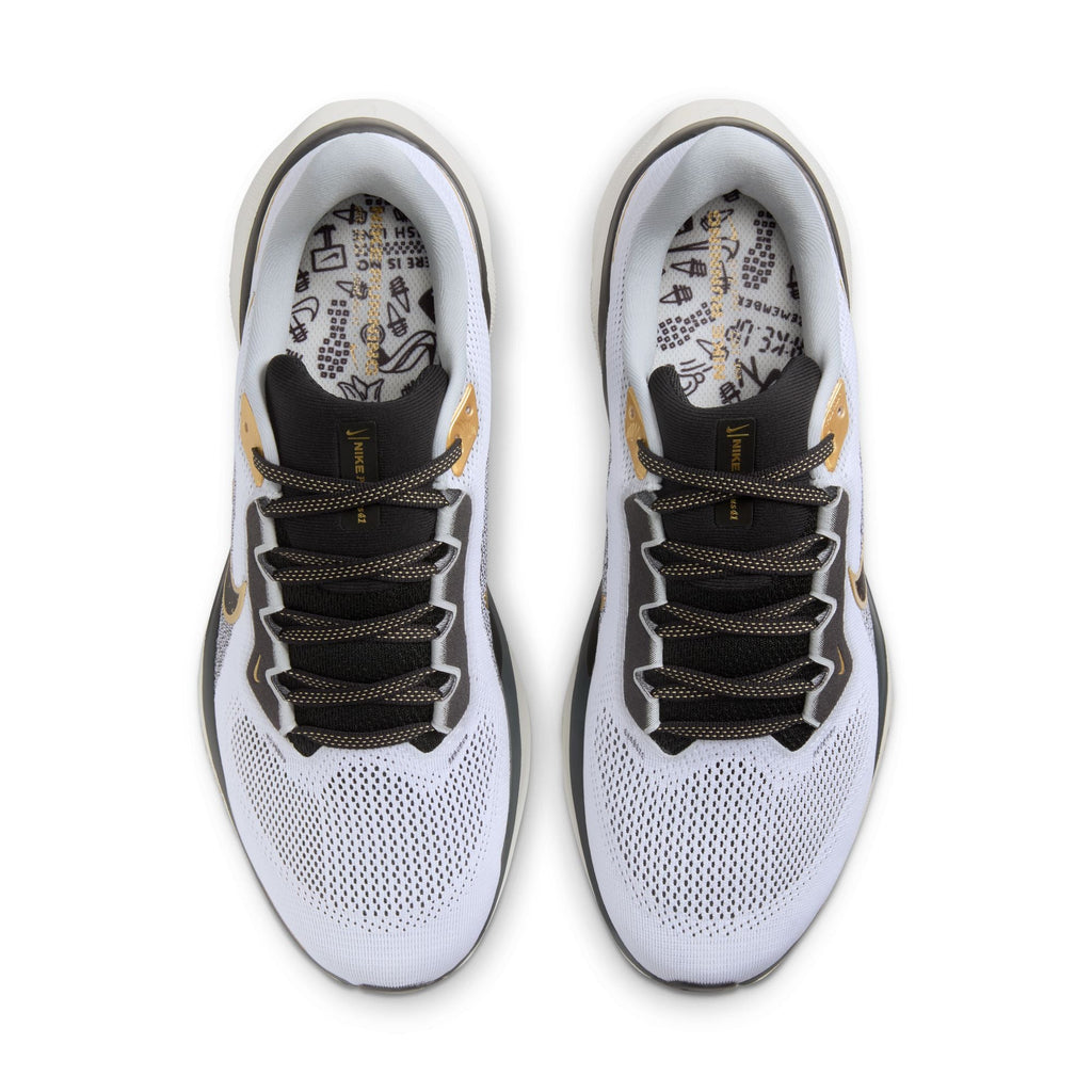 A pair of white and black Nike Air Zoom Pegasus 41 running shoes with black and gold accents and a white and black sole.