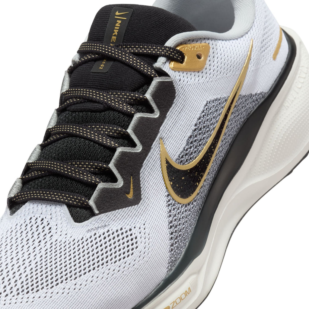 A pair of white and black Nike Air Zoom Pegasus 41 running shoes with black and gold accents and a white and black sole.