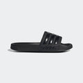 Adidas Adilette Shower Slides in solid black with textured footbed and three-stripe design on the band, side view.