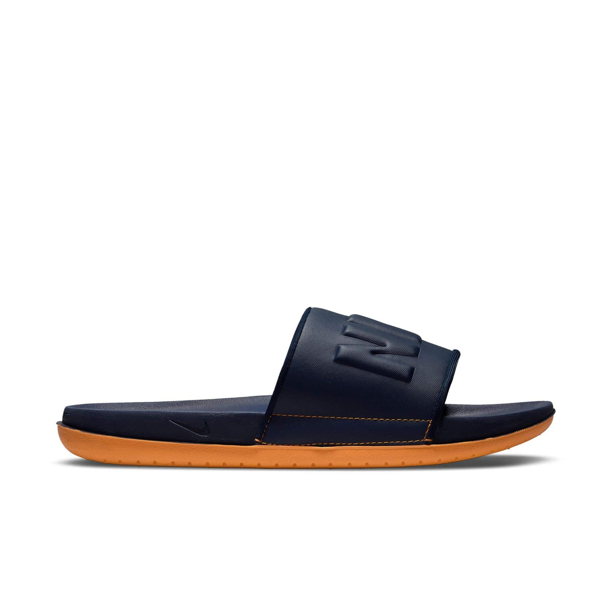 Nike Offcourt Slide sandals in navy blue with cushioned strap featuring embossed logo, orange foam sole, side view.