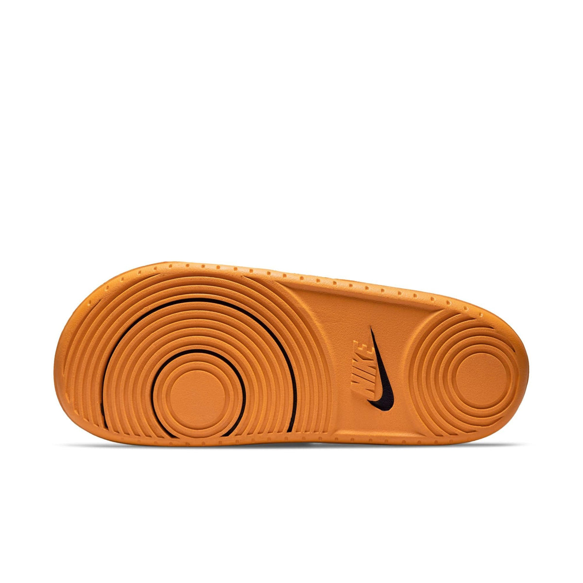 Nike Offcourt Slide sandal outsole in bright orange rubber featuring circular textured patterns and black Nike logo.