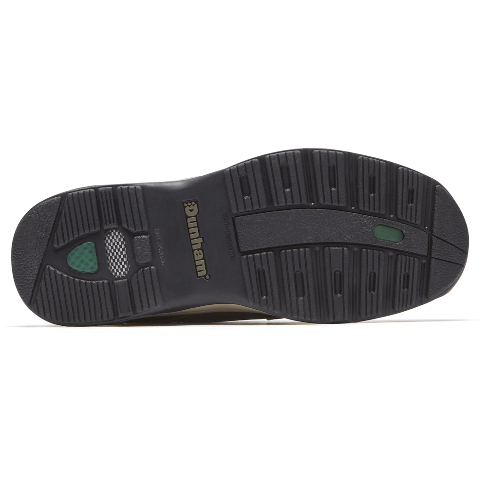 Dunham 8000 Mid Waterproof Boot outsole in black rubber with lugged tread pattern and green accent detailing.