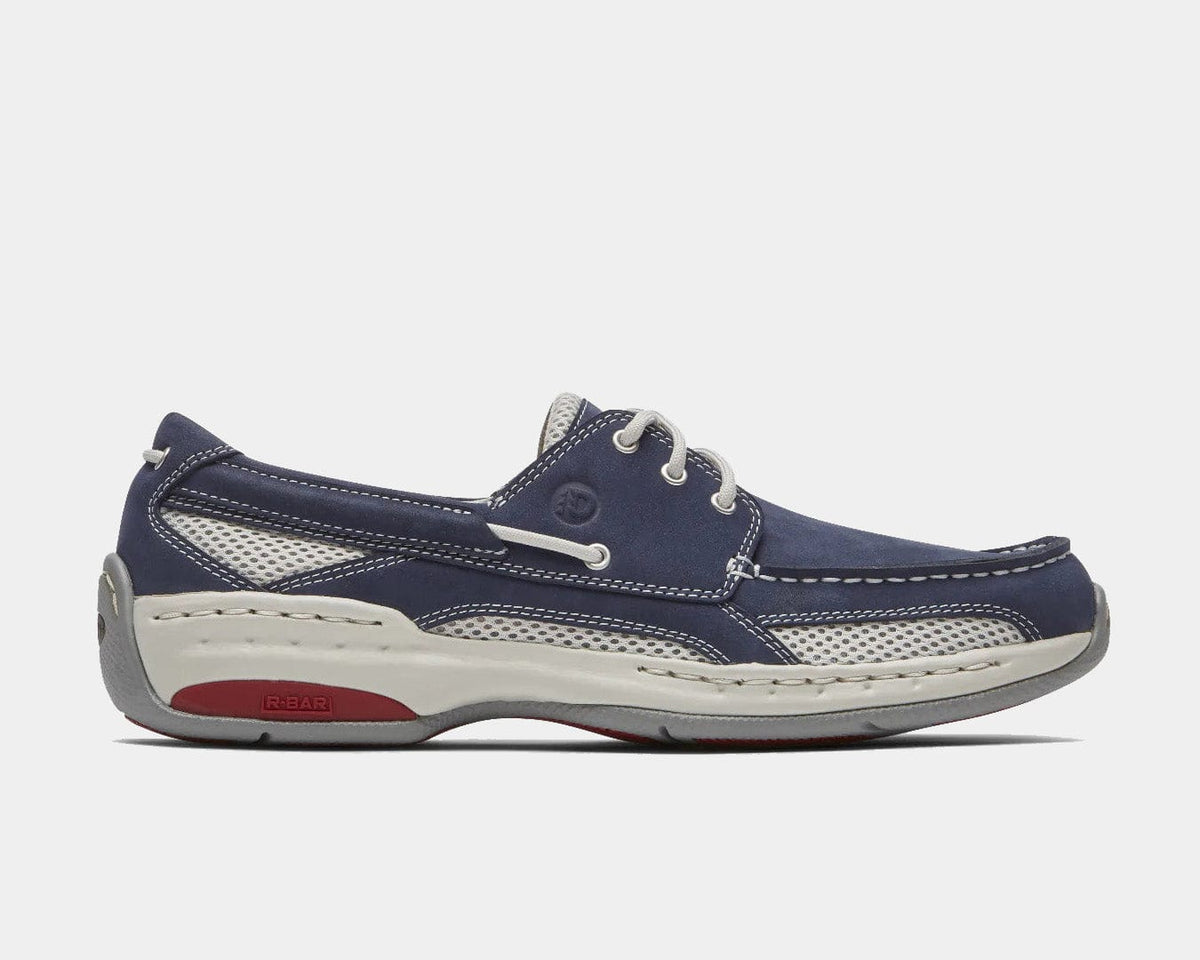 Dunham Captain boat shoes in navy blue with white stitching, mesh panels, and white sole, side view.