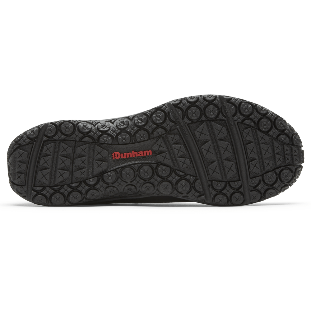 Dunham Cloud Plus Waterproof Slip-On shoe outsole with black rubber tread and red branding, bottom view.