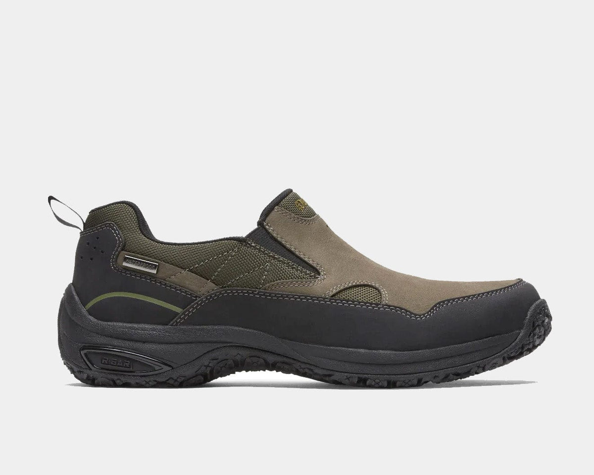 Dunham Cloud Plus Waterproof Slip-On shoes, brown suede with black rubber accents, durable outsole and pull tab, side view.