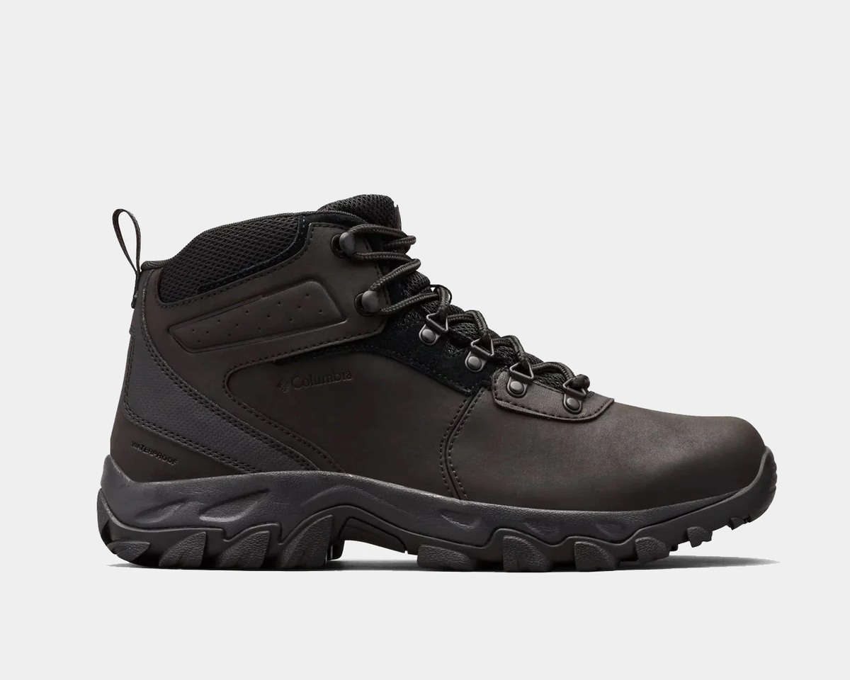 Columbia Newton Ridge Plus II Waterproof hiking boots in black with leather upper, metal eyelets, and rugged outsole, side view.