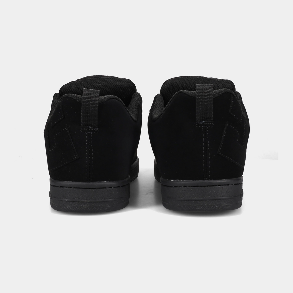 DC Footwear Court Graffik sneakers in black suede with padded collars and heel pull tabs, back view.