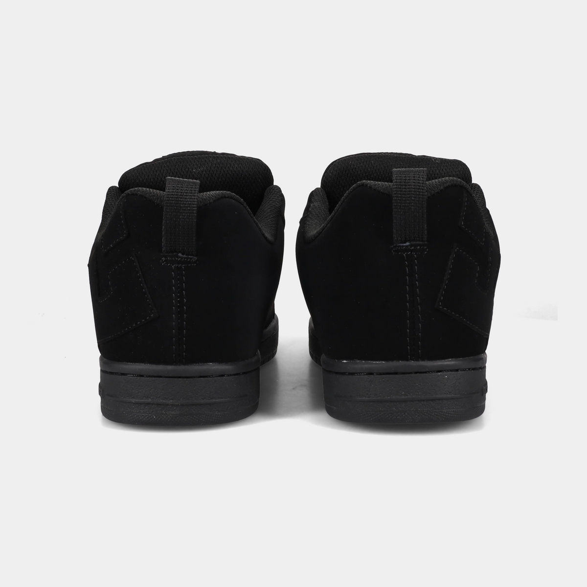 DC Footwear Court Graffik sneakers in black suede with padded collars and heel pull tabs, back view.
