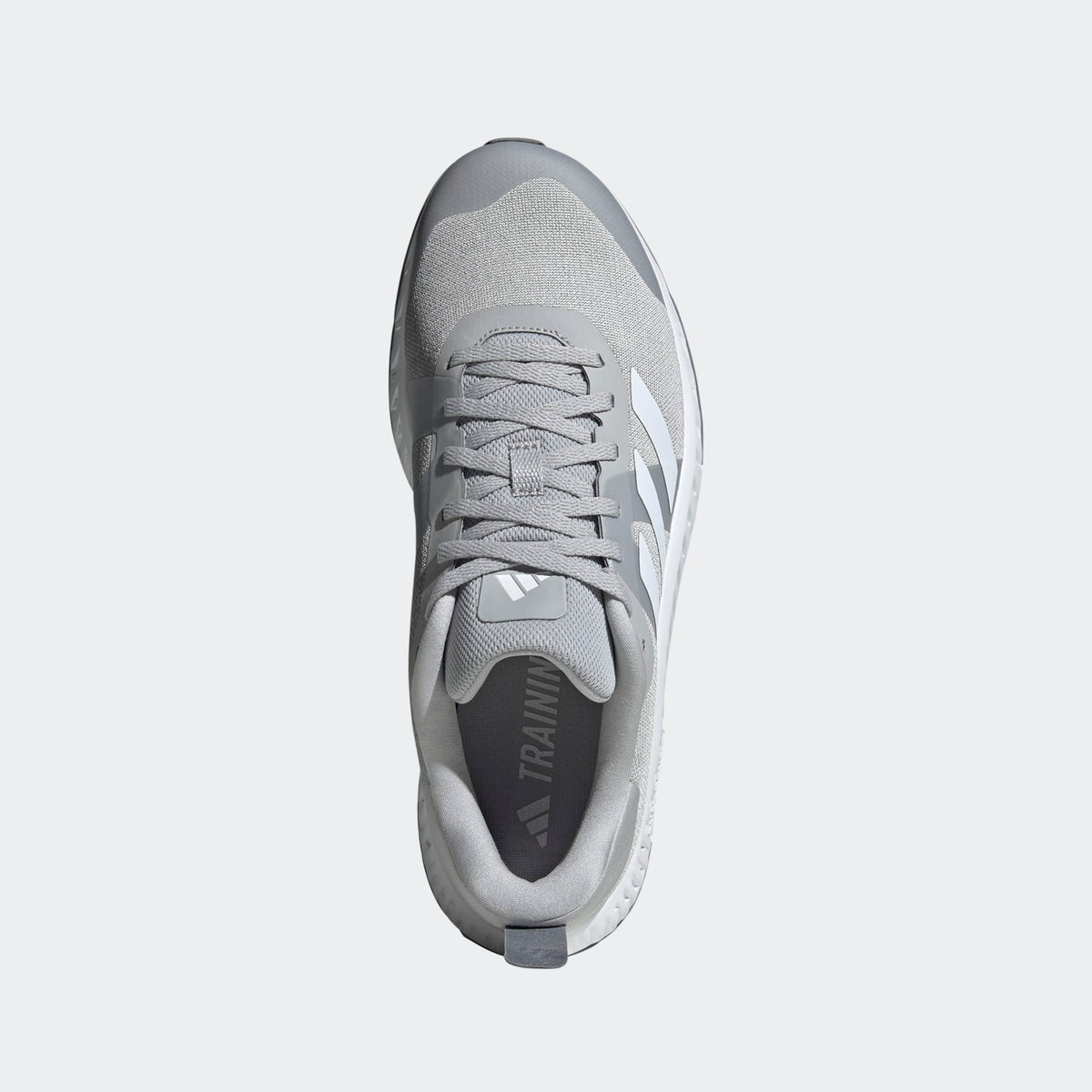 Adidas Everyset Trainer shoes in light gray with mesh upper, lace-up closure, and branded insole, top view.
