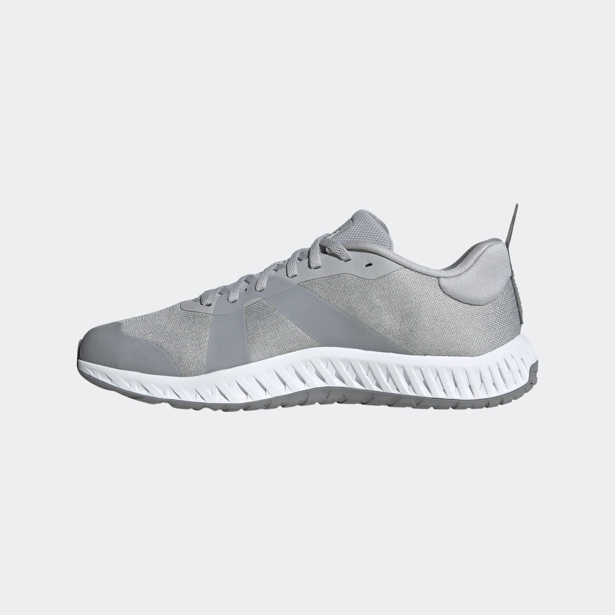 Adidas Everyset Trainer shoes in gray with mesh upper, synthetic overlays, and white textured midsole, side view.
