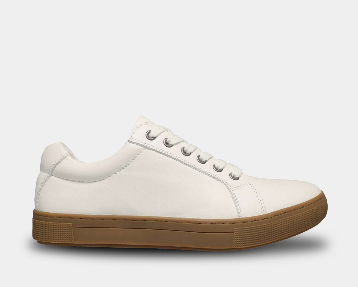 Propét Koda sneakers in white leather with a gum rubber outsole and lace-up closure, side view.