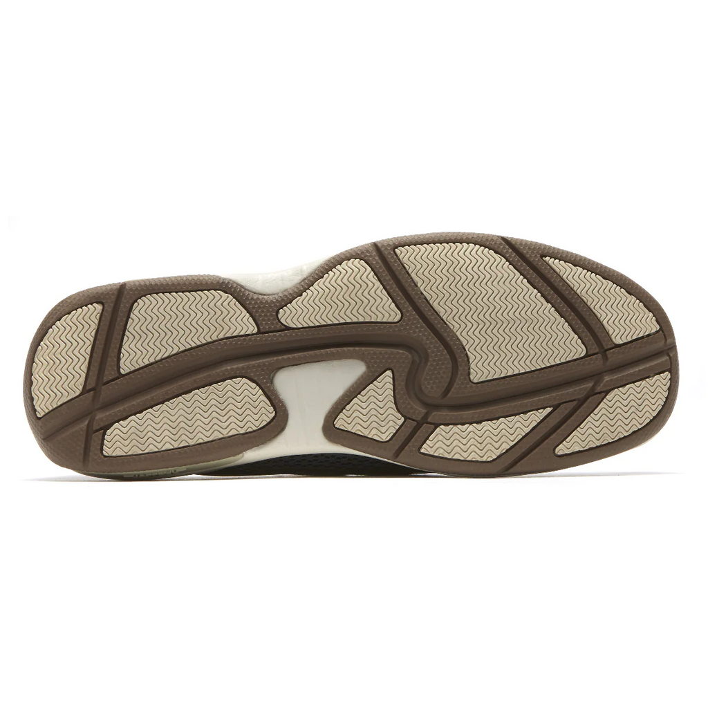 Dunham Captain shoe outsole in brown and beige rubber featuring a textured tread pattern for traction, bottom view.