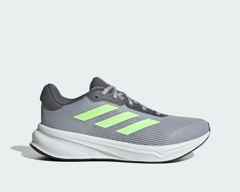 Adidas Response running shoes in gray with neon green stripes, featuring a breathable mesh upper and cushioned midsole, side view.
