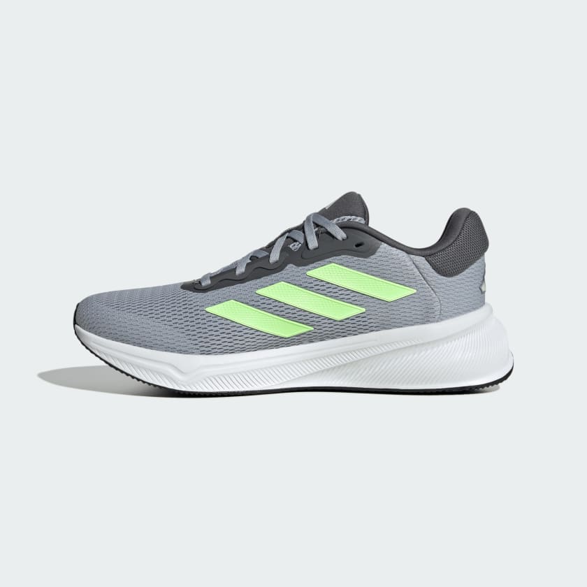 Adidas Response running shoes in gray with lime green stripes, featuring a breathable mesh upper and cushioned white midsole, side view.