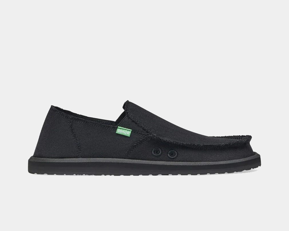 Sanuk Vagabond slip-on shoes in black with frayed edges, dual elastic gores, and lightweight rubber outsole, side view.