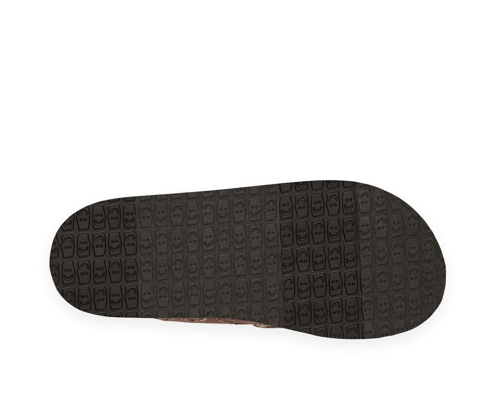 Sanuk Vagabond shoes outsole in black rubber featuring textured smiley face pattern, sole/bottom view.