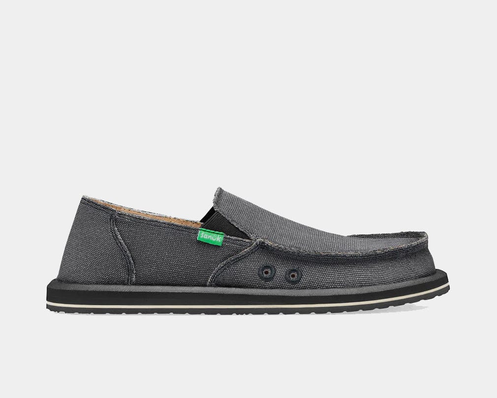 Sanuk Vagabond slip-on shoes in charcoal gray with canvas upper, visible stitching, and flexible sole, side view.