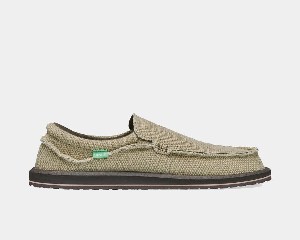 Sanuk Chiba slip-on shoes in light tan woven fabric with frayed edges and a cushioned black sole, side view.