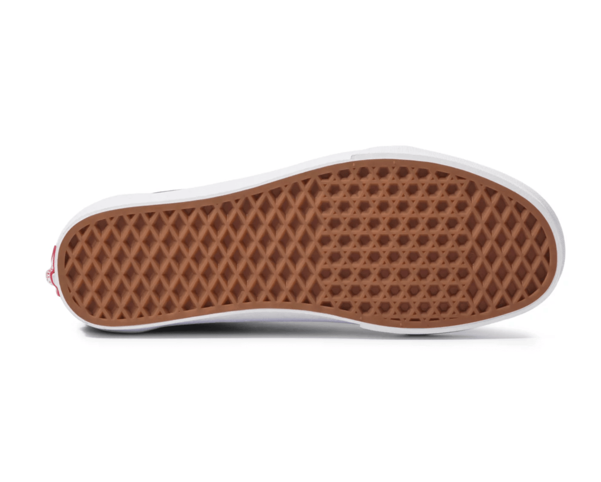 Vans Old Skool shoes outsole showing waffle tread pattern in gum rubber for grip and durability.