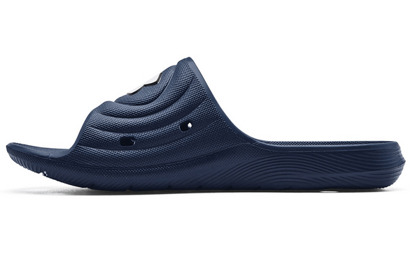 Under Armour Locker IV SL sandals in navy blue with textured footbed and drainage holes, side view.