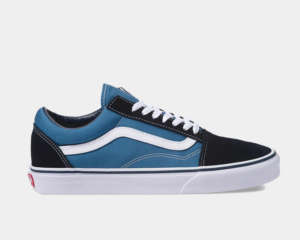 Vans Old Skool sneakers in black and navy blue with white side stripe, suede and canvas upper, and white rubber sole, side view.