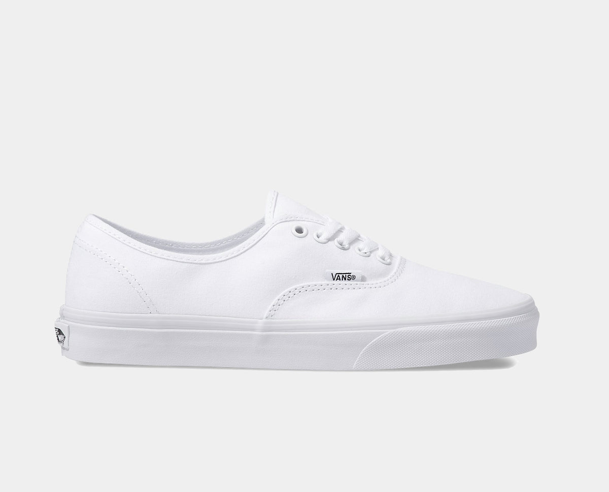 Vans Authentic shoes in crisp white canvas with low-top design, lace-up closure, and waffle outsole, side view.