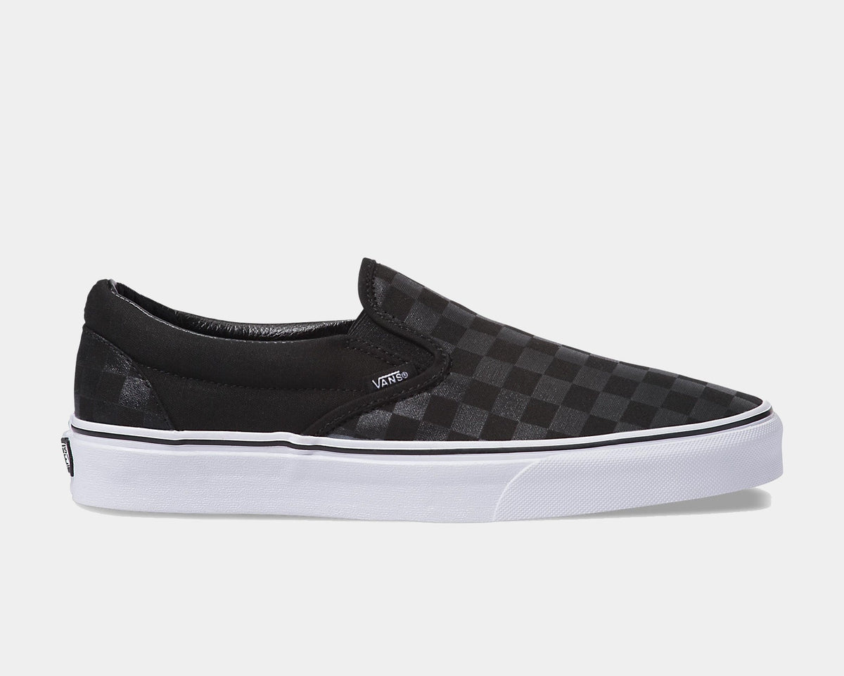 Vans Checkerboard Slip On shoes in black with tonal checkerboard pattern and white rubber sole, side view.