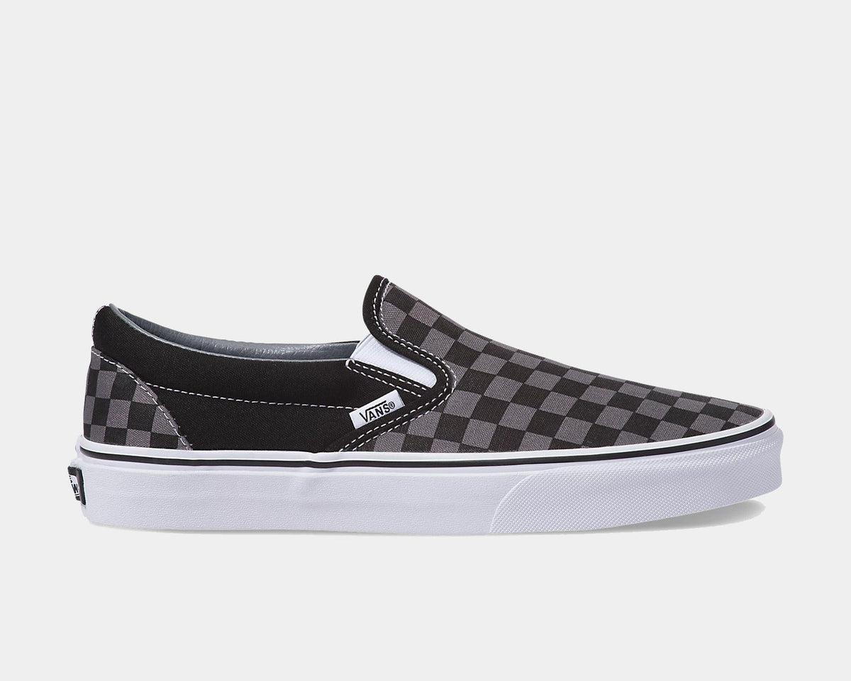 Vans Checkerboard Slip-On shoes in black and gray checkered canvas upper with white midsole, side view.