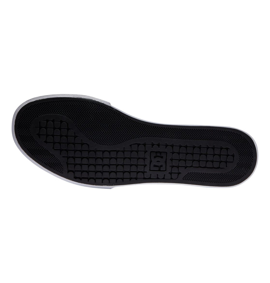 DC Footwear Pure High Top WC shoe outsole in black rubber with textured tread pattern and logo detail.