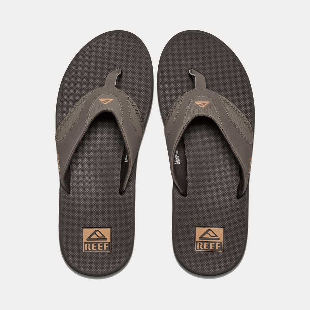Reef Fanning Flip Flops in brown with synthetic straps and textured footbed featuring a bottle opener, top view.