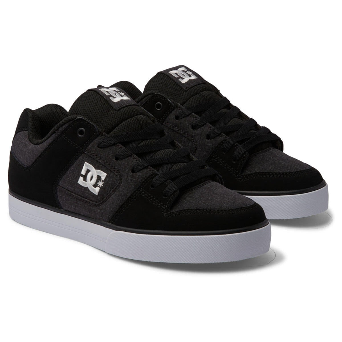 DC Footwear Pure skate shoes in black and gray with stitched detailing, padded tongue, white outsole, front angled view.