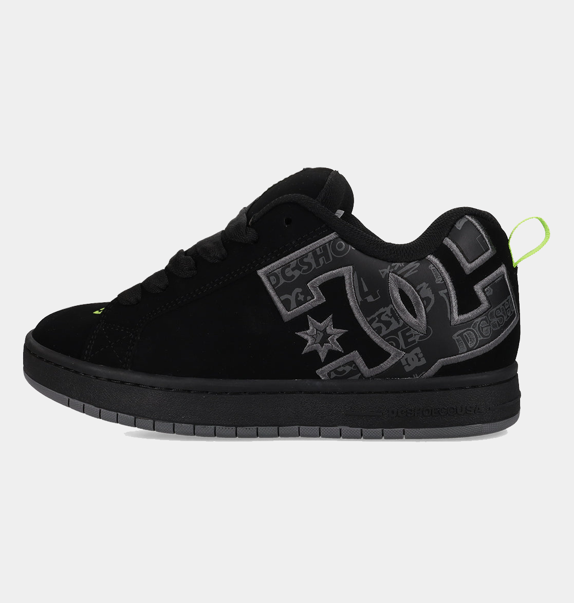 DC Footwear Court Graffik skate shoes in black with gray logo detailing and neon green heel tab, side view.