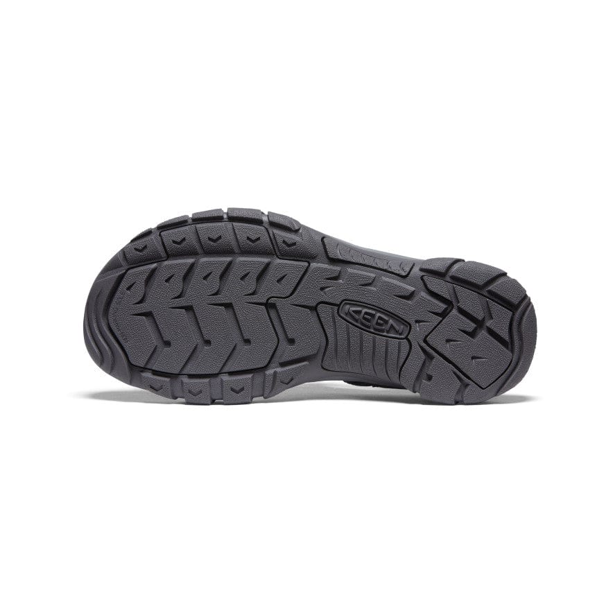 Keen Newport H2 sandal outsole in black rubber showing multi-directional tread pattern and KEEN logo, bottom view.