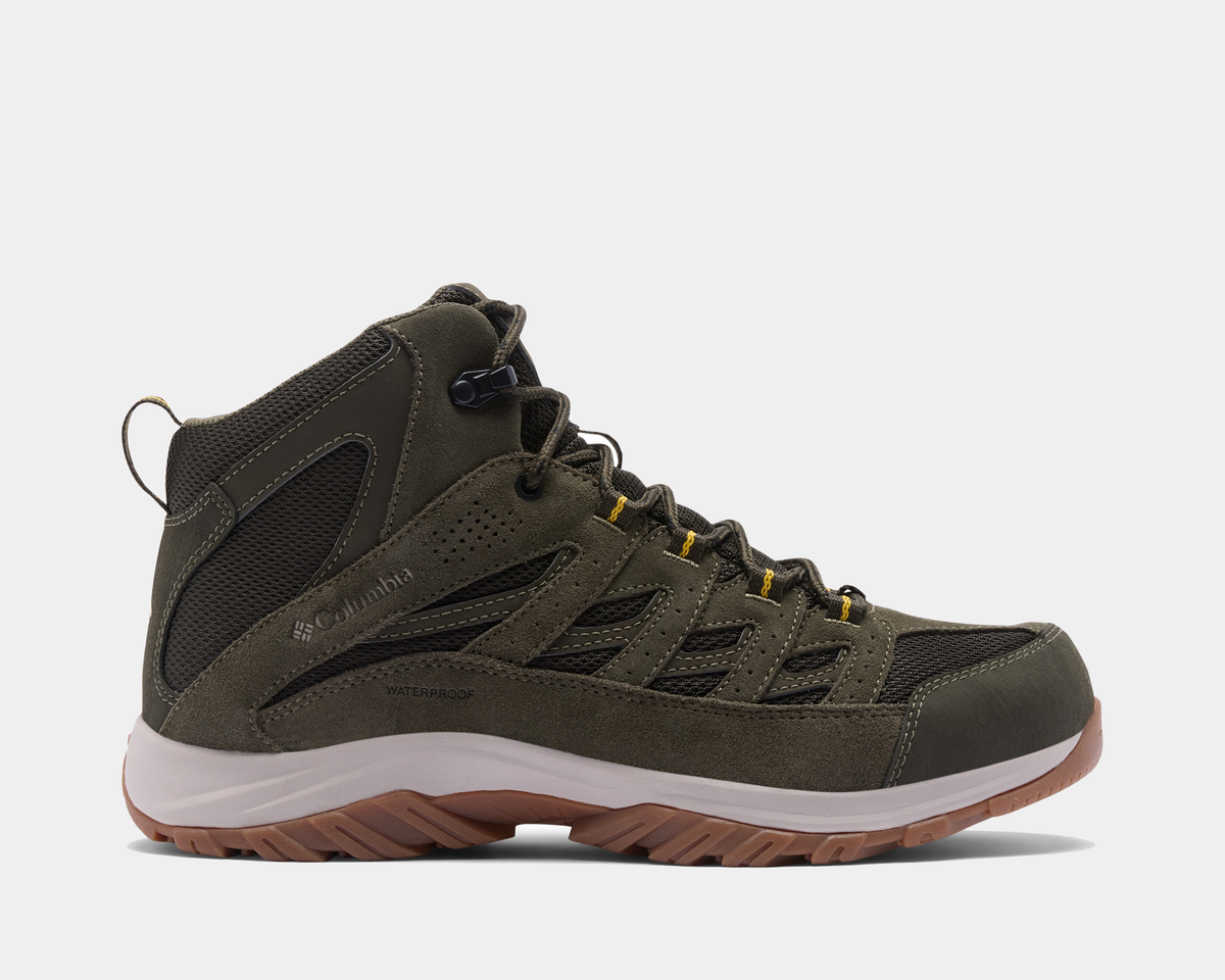 Columbia Crestwood Mid Waterproof hiking boots in olive green with suede and mesh upper, waterproof design, and brown rubber outsole, side view.