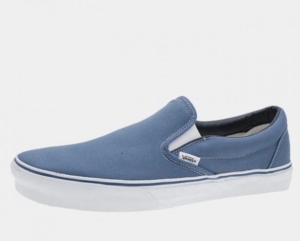 Vans Classic Slip On shoes in blue canvas with elastic side accents and white rubber sole, side view.