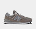 New Balance 574 Core sneakers in gray with suede overlays, breathable mesh panels, white laces, and durable ENCAP midsole, side view.