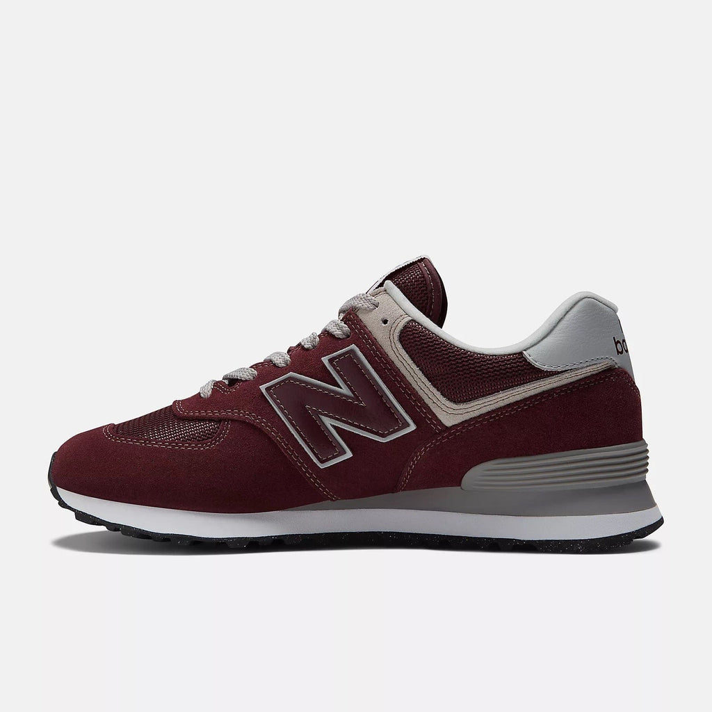 New Balance 574 Core sneakers in burgundy suede and mesh with gray accents and rubber outsole, side view.