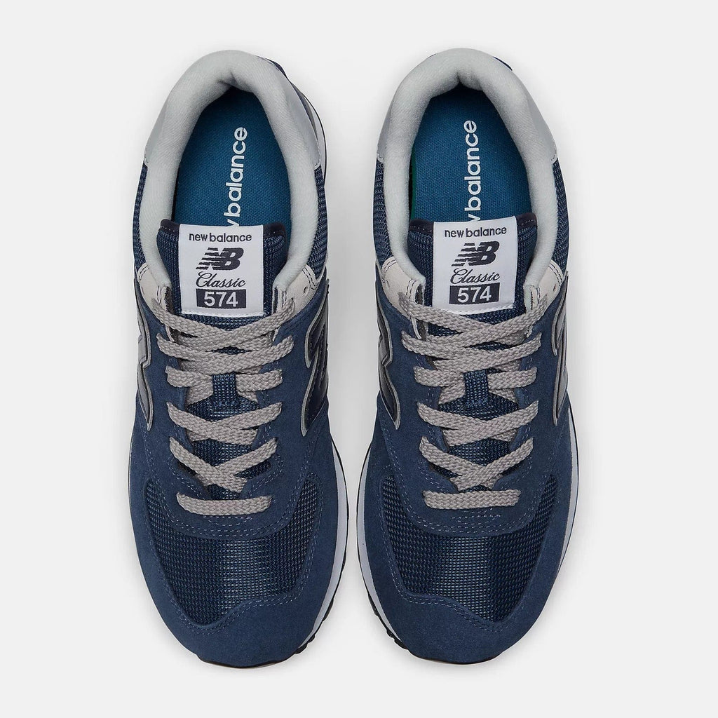 New Balance 574 Core shoes top view showing navy blue suede and mesh upper with gray laces and tongue branding.