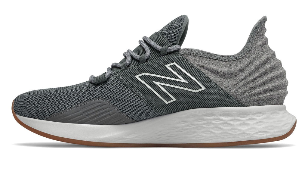 New Balance Fresh Foam Roav Tee Shirt running shoes in gray and white with mesh upper, Fresh Foam midsole, and gum outsole, side view.