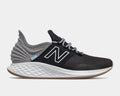 New Balance Fresh Foam Roav Tee Shirt running shoes in black and gray with mesh upper, Fresh Foam midsole, and gum outsole, side view.